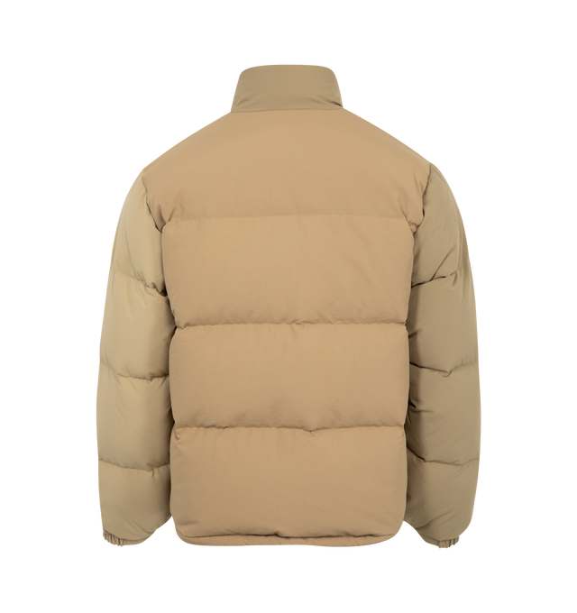 Image 2 of 6 - BROWN - Human Made Down jacket with a voluminous silhouette. The reversible design features a solid color on one side and a crazy pattern on the other, opening up a range of styling options. Material: Nylon. Filling: Down/Polyester. 