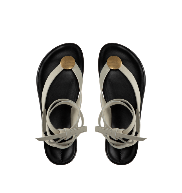 Image 4 of 4 - GREY - The Row wrapped thong sandal in soft nubuck leather with metal circular charm, hand-stitched detailing, and polished leather insole. 100% Leather with rubber sole.Made in Italy. 