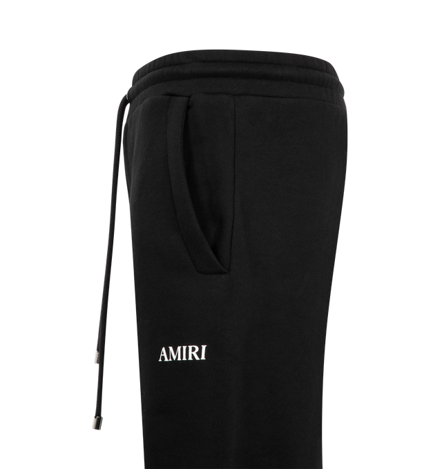 Image 3 of 3 - BLACK - Amiri Mens Relaxed Pull-On Sweatpants are crafted from cotton. Features a relaxed fit, elasticized pull-on waistband, side seam pockets, back pockets, and signature AMIRI logo. Main Material: 100% Cotton. Made in USA. 