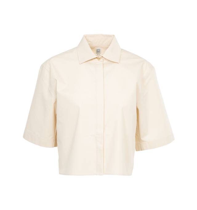 Image 1 of 3 - WHITE - TOTEME Cropped Cotton Poplin Shirt featuring a wide, cropped silhouette, light organic-cotton poplin with a concealed button placket and a neat box pleat running down the back. 100% organic cotton. 