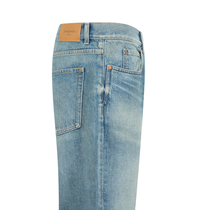 Image 3 of 3 - BLUE - Saint Laurent Men's Relaxed Tapered Jeans are crafted from certified cotton and feature a mid-rise waist, relaxed tapered leg, center crease, button fly, five-pocket styling, belt loops, and a Saint Laurent Paris embossed leather jacron. This designer denim combines modern tailoring with signature Saint Laurent detailing for elevated everyday wear. Main Material: Cotton. Made in Japan. 