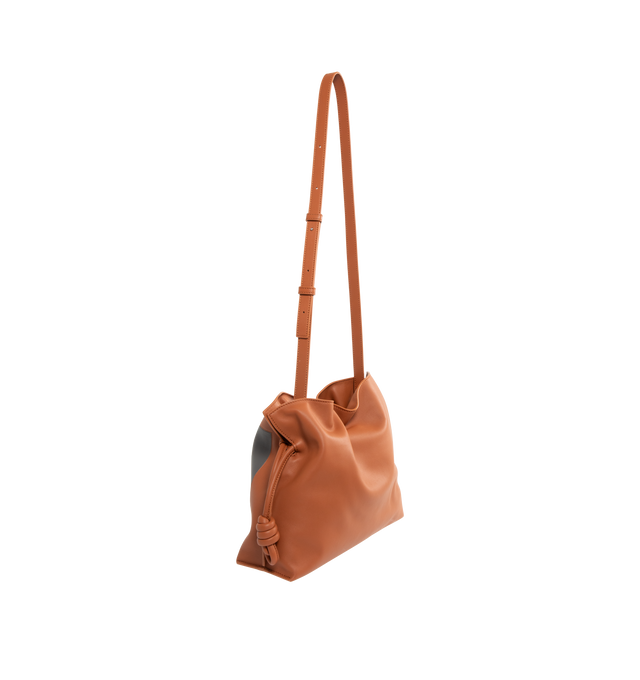 Image 2 of 3 - MULTI - Loewe Square Medium Flamenco clutch is a soft and slouchy bag with a cinched closure and knot drawstrings, crafted in nappa calfskin. Shoulder, crossbody or hand carry with detachable and adjustable strap. Featuring magnetic closure, suede lining, and gold embossed LOEWE. Main material: Nappa Calf. Strap length 96 - 120 cm. Strap Drop 38 - 44 cm. Measures 24.5 cm tall x 30 cm wide x 10.5 cm deep. Made in Spain.The Flamenco clutch Landscape is a soft and slouchy bag with a cinched clos 