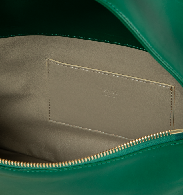 Image 3 of 3 - GREEN - KHAITE Elena Bag featuring a broad, integrated shoulder strap, zippered top, nappa lining, and internal slip pocket. 11 x 3.5 x 7.5 in. Handle Drop: 6.5 in. 100% calfskin. 