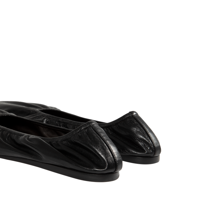 Image 3 of 4 - BLACK - THE ROW Liisa Flat Shoe featuring minimal flat shoe in soft lambskin leather with pointed toe, soft elastic trim, and leather sole. 100% lambskin leather. Leather sole. Made in Italy. 