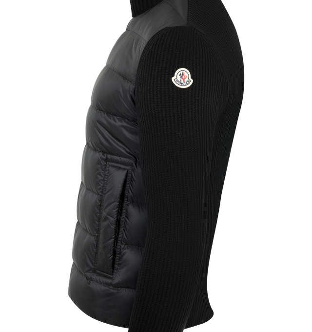 Image 3 of 3 - BLACK - MONCLER Padded Wool & Cashmere Zip-Up Cardigan featuring a wool and cashmere blend, micro chic nylon lining, down-filled front, interlock knit, gauge 12, zipper closure, zipped pockets with an embossed leather trim and leather logo patch. 100% polyester. 90% virgin wool, 10% cashmere. Padding: 90% down, 10% feather. Made in Moldova. 