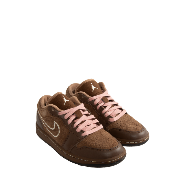 Image 2 of 5 - BROWN - Air Jordan 1 Low SE Women's Shoes pair the timeless design of the original AJ1 with premium materials and everyday comfort. Crafted with a genuine leather upper, this low-top silhouette is designed with Nike Air cushioning and a foam midsole for lightweight support, while a durable rubber outsole provides reliable traction. Main Material: Genuine Leather Upper. Cushioning: Nike Air Technology with Foam Midsole. Outsole: Rubber. 