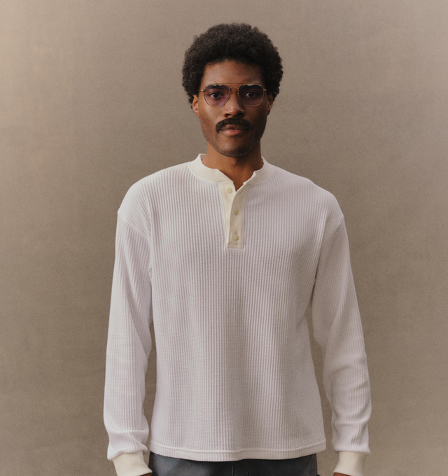 Image 4 of 6 - WHITE - Cherry LA Men's Henley Thermal is crafted from a custom poly-cotton thermal fabric and features a fitted silhouette with a classic Henley neckline. Designed with embroidered detailing at the back and finished with two-hole cat-eye buttons, this everyday essential combines vintage-inspired thermal styling with Cherry LA's signature craftsmanship. Main Material: Custom Poly-Cotton Thermal. Made in Los Angeles, California. 