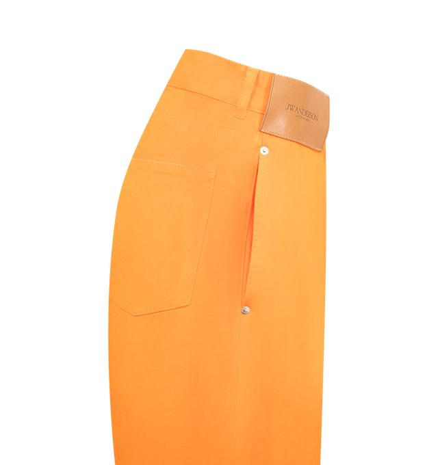 Image 3 of 3 - ORANGE - JW ANDERSON Twisted Workwear Jeans featuring a large leather logo patch, anchor stitched pocket, engraved metal shank buttons, logo rivets and orange binding. 100% cotton. Made in Japan. 