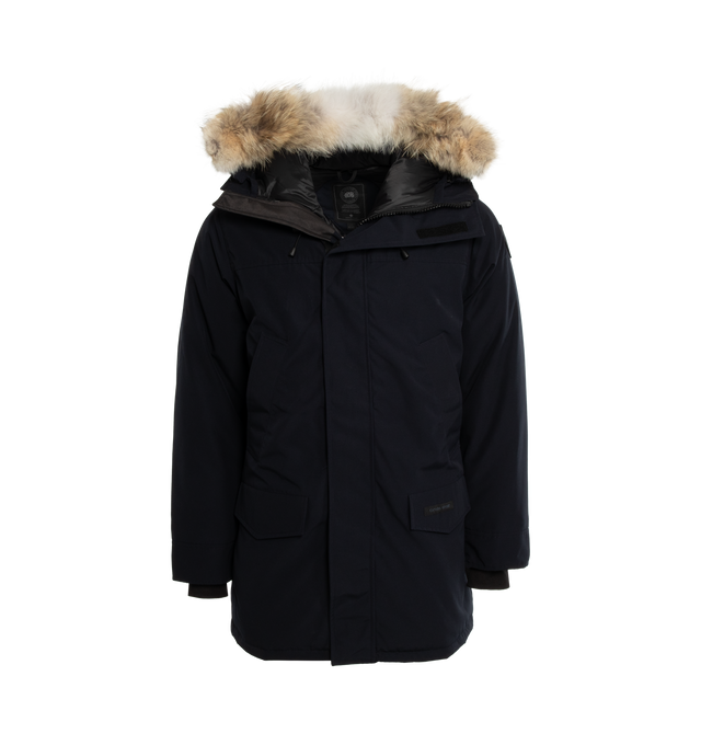 NAVY - CANADA GOOSE Langford Parka featuring hidden dual zip and velcro front closures, side welt pockets, front flap pockets and removable fur trim. 85% poly, 15% cotton. Lining: 100% nylon. Filling: 100% white duck down. Padding: 100% poly. Trim: 100% real natural whole coyote fur.