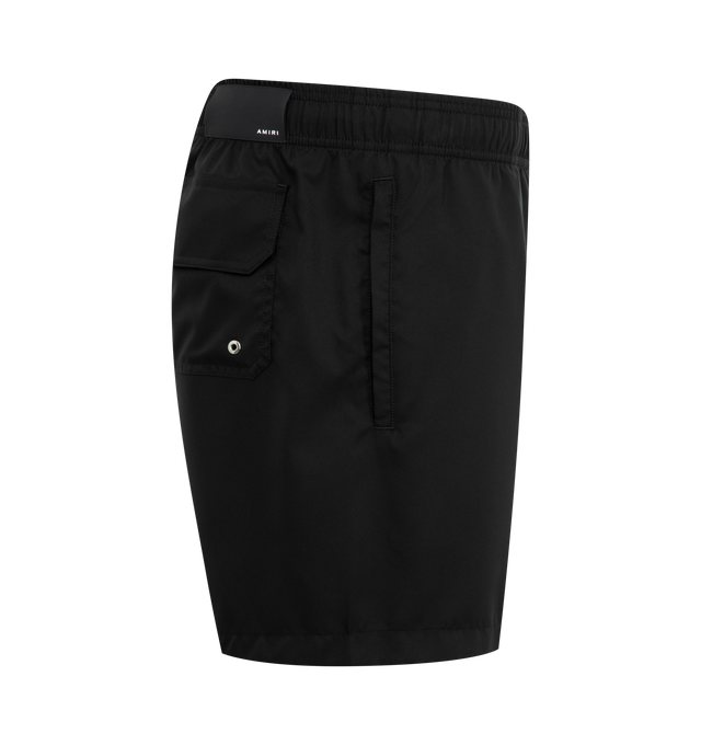 Image 3 of 3 - BLACK - Amiri Hollywood Swim Trunks have an elastic drawstring waist, side pockets, a rear patch pocket, a logo on the front, and a mesh lining. Made in Bosnia.  