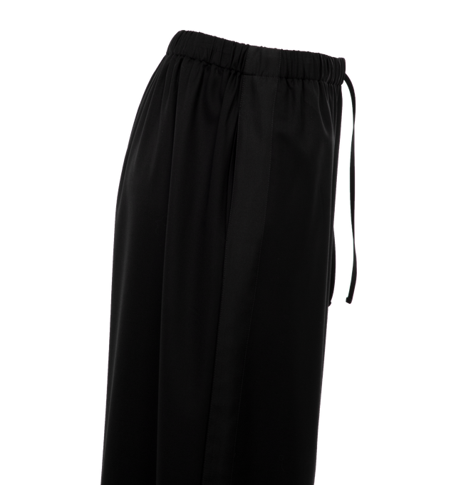 Image 3 of 4 - BLACK - THE ROW Hubert Pant featuring a mid-rise pant in extra fine wool tailoring with tuxedo stripe, drawstring waistband, and side seam pockets. 100% wool. Made in Italy. 