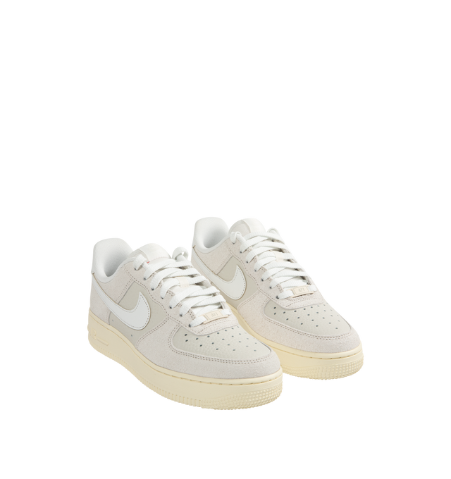 Image 2 of 5 - WHITE - Nike Air Force 1 '07 LX Sneakers lace-up style with tumbled leather and shaggy suede textural upper, Coconut Milk sidewalls and outsole with crisp Summit White Swoosh logos, stitched overlays, Nike Air cushioning, padded collars, foam midsoles, and rubber soles. 