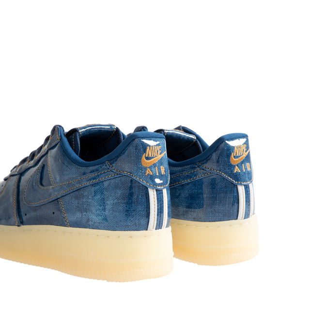 Image 3 of 5 - BLUE - Nike Men's Air Force 1 Low Retro Premium Sneaker featuring patent leather denim upper with perforated toe box, Nike Air technology and rubber outsole with heritage hoops pivot circles. 