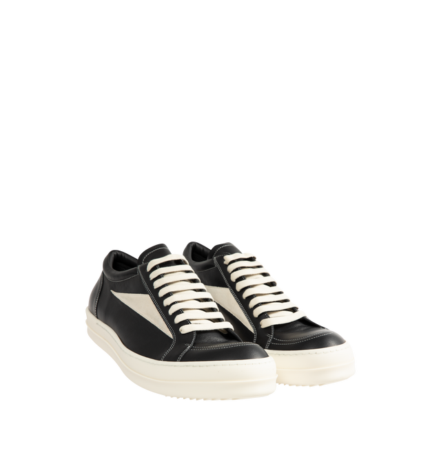 Image 2 of 5 - BLACK - Rick Owens Mens Vintage Sneakers feature a full-grain calf leather and suede upper. Designed with an under-ankle silhouette, eight-eyelet lace-up closure, toe cap, resized triangular leather side appliqu, padded ankle, contrast stitching, and shark-tooth thermoplastic rubber outsole. Upper: 100% Cow Leather; Lateral Details: 100% Calf Leather; Lining: 100% Calf Leather; Insole: 100% Calf Leather; Outsole: 100% Thermoplastic Rubber. Sole Height: 3.5 cm. Made in Italy. 