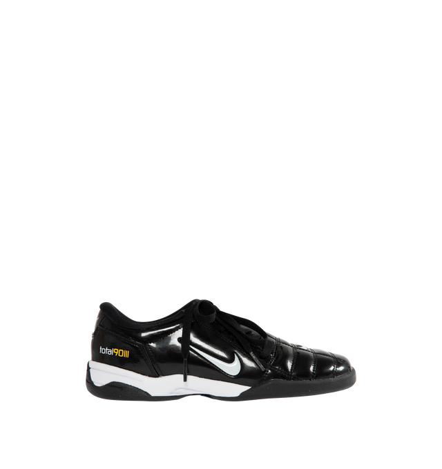 Image 1 of 5 - BLACK - NIKE T90 SP Sneaker featuring authentic soccer style, flat rubber sole, quilted upper, asymmetrical lacing, glossy black and white finish combines with Tour Yellow and Metallic Silver. 