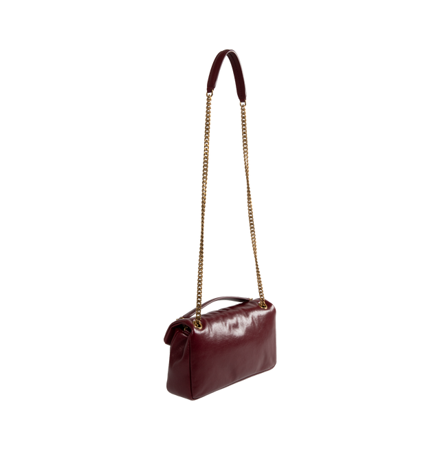 Image 3 of 4 - RED - Saint Laurent YSL Small Calypso Shoulder Bag has a snap button closure, bronze-tone hardware, an interior zipper pocket, and a sliding chain strap. 10.2 X 5.5 X 2.8 inches. Lined. 100% calfkin. Made in Italy.  