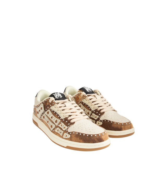 Image 2 of 5 - BROWN - AMIRI Stud Skel Top Low Sneaker featuring bone appliques, stud detailing, two-tone rubber sole with an upper paneled with washed denim and textured suede. 95% cotton, 5% polyester. Sole: rubber. 