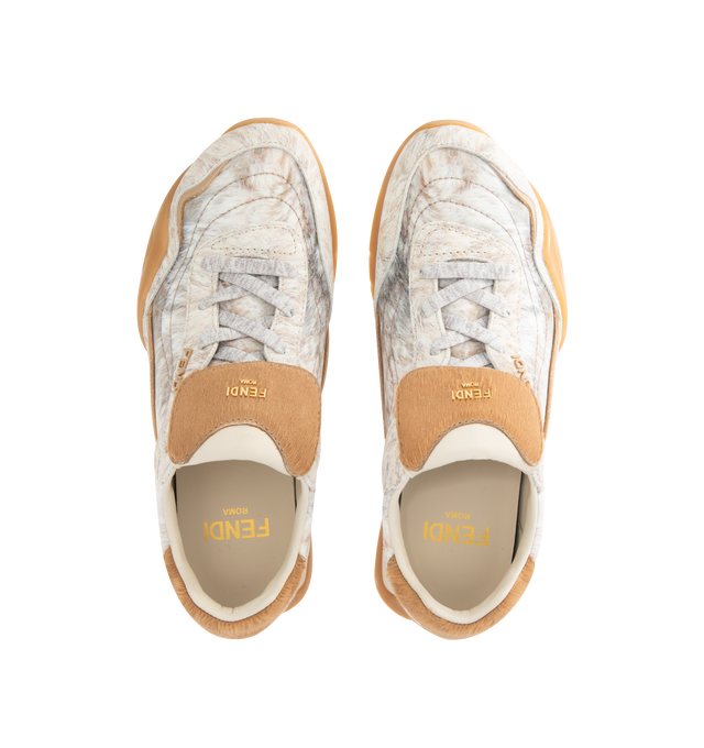 Image 5 of 5 - NEUTRAL - FENDI Wave Pulse Sneaker featuring low-tops, lace-up, made of technical fabric with a white graphic print an beige suede inserts, cavallino calfskin fold-over tongue and heel counter, three-dimensional rubber logo on the side, gold metal Fendi logo on the tongue, rubber running sole with wraparound edge on the side and diagonal F motif. 100% calfskin, 100% polyamide, inside: 100% lamb leather. Made in Italy. 