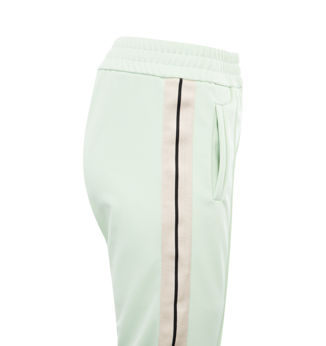 Image 3 of 3 - GREEN - PALM ANGELS CLASSIC LOGO TRACK PANTS with elastic waistband, ecru side bands and vertical pockets, ankle zippers and white embroidered logo at the front thigh. 100% polyester.  