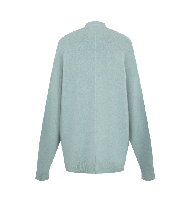 Image 2 of 2 - GREEN - Extreme Cashmere Women's N24 Tokio Cardigan Sweater is crafted from a premium cashmere blend and features a relaxed silhouette with dropped shoulders, two front patch pockets, and a unique side button that allows for adjustable styling. This designer cashmere cardigan combines exceptional softness with versatile functionality, while durable natural corozo buttons add a refined finishing touch. Main Material: 88% Cashmere, 10% Nylon, 2% Elastane. 