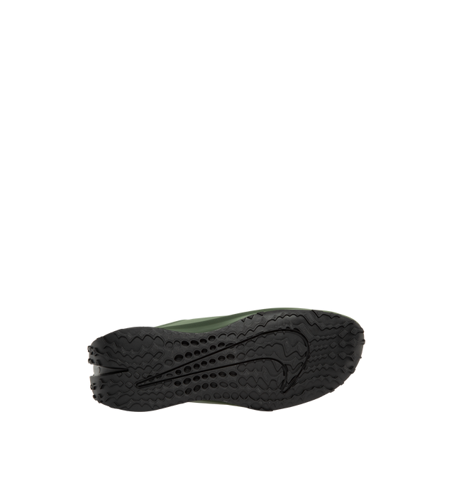 Image 4 of 5 - GREEN - Nike Women's First Sight Noir Sneakers are crafted from a sleek one-piece upper and feature a sculptural silhouette inspired by Nike's running heritage. Designed as the debut style in the First Sight collection, this fashion-forward sneaker is defined by a circular heel cutout, a thick angular foam midsole, and bold branding details that blend athletic performance with modern statement styling. Main Material: Synthetic Upper. Midsole: Soft Foam Cushioning. Closure: Lace-Up. Details: O 