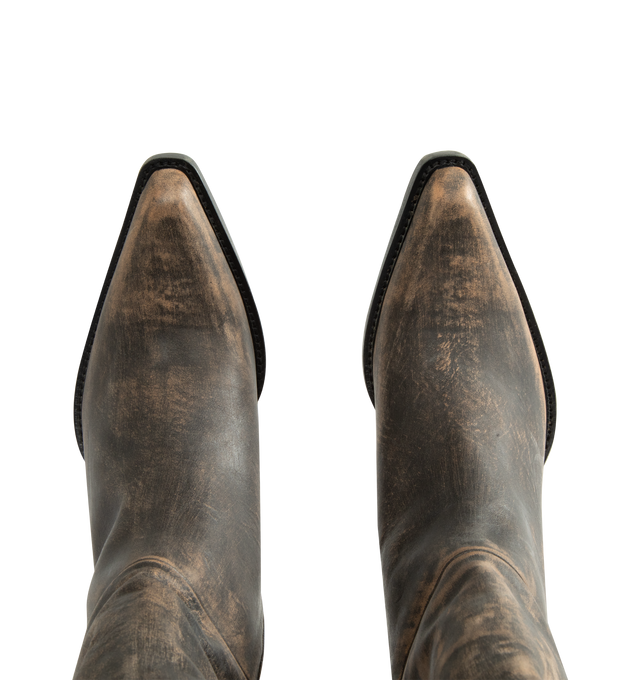 Image 4 of 4 - BROWN - Khaite Women's Clive Boot is crafted from vintage vacchetta calf leather and features a sharp snip-toe silhouette inspired by well-worn Western classics. Defined by a deliberately tilted shaft, the design is rendered in hand-worked, vegetable-tanned calfskin brushed to develop a rich patina over time. A stitched welt and stacked leather heel complete the distinctive construction. Main Material: 100% Calf Leather. Upper: Vegetable-Tanned Calfskin. Heel Height: 2.5 cm / 1 in. Toe: Snip  