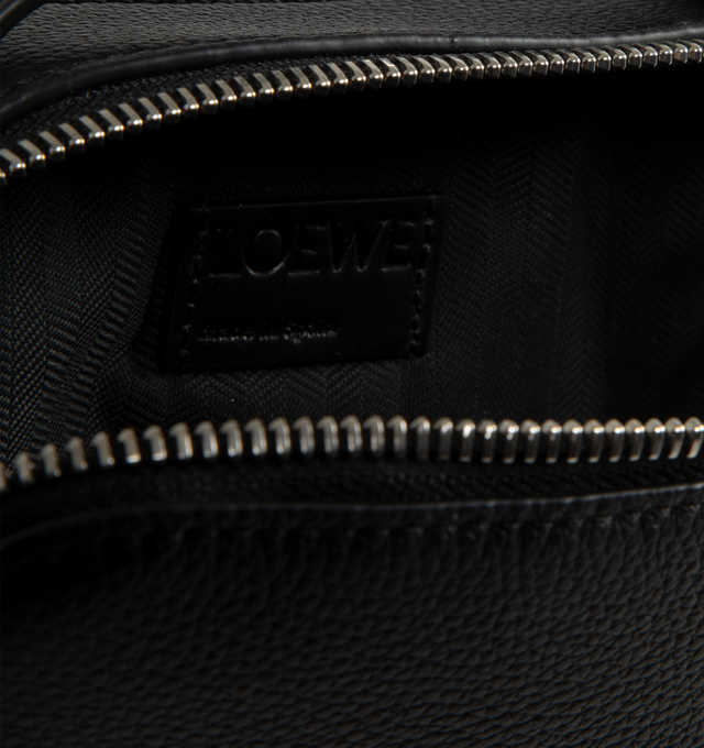 Image 3 of 3 - BLACK - Loewe Men's Mini Camera Crossbody bag in soft grained calfskin. Versatile wearable Mini Camera Crossbody bag with two zip compartments, crossbody or top handle carry, adjustable and detachable LOEWE webbing strap, herringbone cotton canvas lining and embossed Anagram. Height 5.1" x Width 7.1" X Depth 3.3". Made in Spain. 