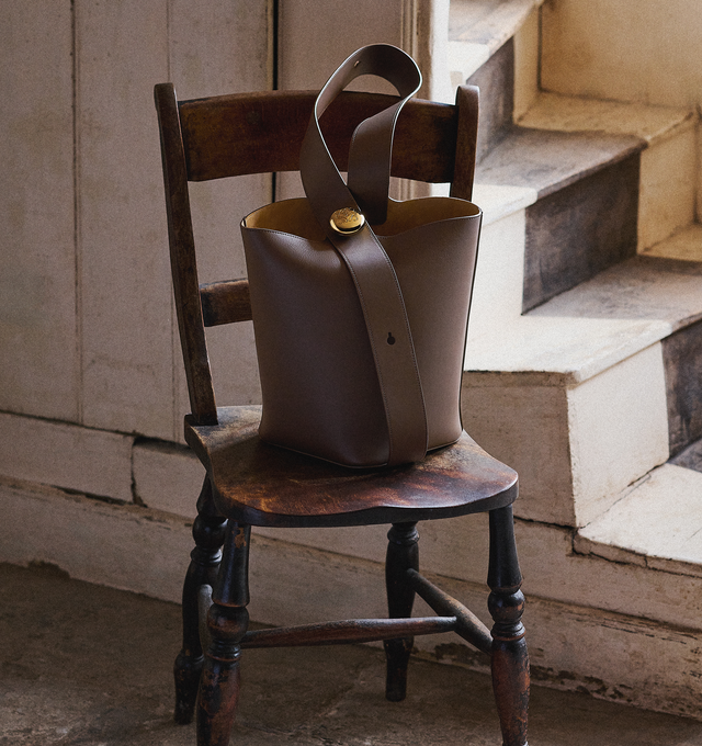 Image 5 of 6 - BROWN - LOEWE Medium Pebble Bucket Bag featuring shoulder or crossbody carry, adjustable strap, magnetic closure, internal pocket, bonded leather lining and Anagram engraved Pebble. 11 x 9.6 x 9.3 inches. Mellow calf. Made in Spain. 