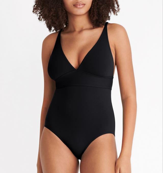 Image 4 of 6 - BLACK - ERES Larcin One-Piece Triangle Swimsuit featuring thin straps, V-neckline and underbust seam. 84% Polyamid, 16% Spandex. Made in France. 
