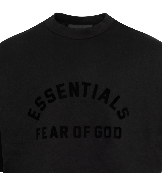 Image 2 of 2 - BLACK - FEAR OF GOD ESSENTIALS Crewneck T-Shirt featuring rib knit crewneck, logo bonded at front, dropped shoulders, dolman sleeves and rubberized logo patch at back. 100% cotton. Made in Viet Nam. 