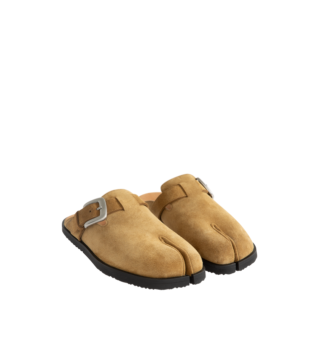 Image 2 of 4 - NEUTRAL - Maison Margiela Women's Tabi Daily Mules are crafted from calf suede and feature the signature split-toe design, a slip-on mule silhouette, open-back construction, an adjustable buckle strap, and a durable rubber sole. These designer suede mules combine the iconic Tabi silhouette with everyday comfort for effortless styling. Main Material: 100% Calf Suede. Lining: 50% Calf Leather, 50% Calf Suede. Sole: 100% Rubber. Heel Height: 1.1 cm. Made in Italy. 