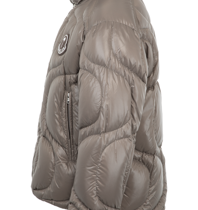 Image 3 of 3 - GREY - Moncler X Palm Angels Haunani Down Jacket has a stand collar, a zipper and snap button closure, a drawstring hem, a signature logo patch, side zip pockets, and adjustable cuffs. Fill 90% down, 10% feather. Exterior 100% polyamide. Made in Romania.  