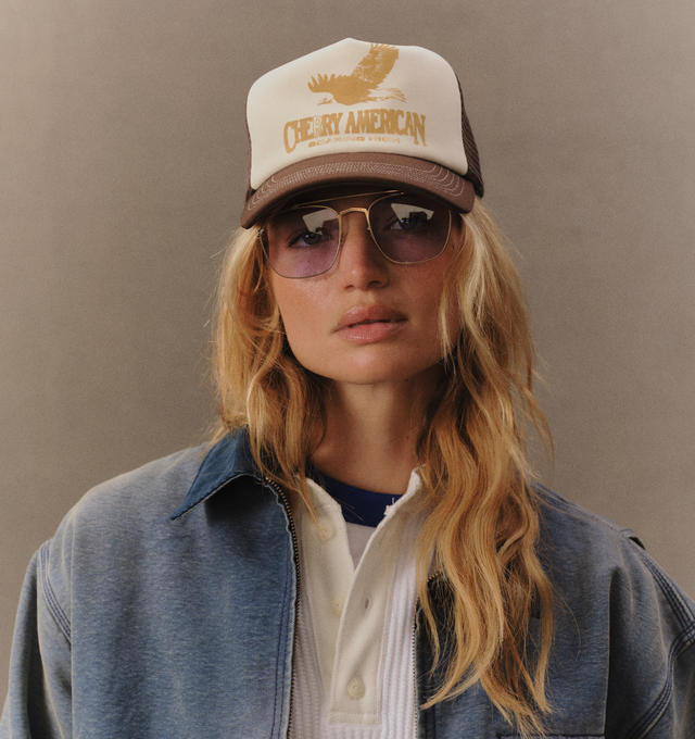 Image 5 of 7 - BROWN - Cherry LA Golden Eagle Trucker Hat is crafted from polyester and features a classic trucker silhouette with a screen-printed Golden Eagle graphic at the front and embroidered detailing at the back. Main Material: Polyester. Fit: Adjustable. Closure: Plastic Snapback Closure. Made in Los Angeles, California. 