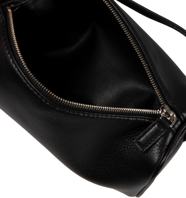 Image 3 of 3 - BLACK - THE ROW Top handle bag in finely grained calfskin leather with softly rounded edges, leather piping and adjustable slim leather strap. Measures 7.7 x 4.5 x 3 in.100% Calfskin Leather. Made in Italy. 