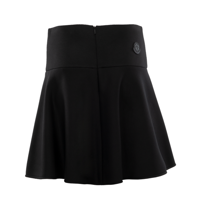 Image 2 of 3 - BLACK - MONCLER Neoprene Lined Flared Mini Skirt featuring high-rise waistband, neoprene lined, tonal back logo patch, hem falls above the knee, circle-cut silhouette and center back zipper. 100% viscose. Made in Italy. 