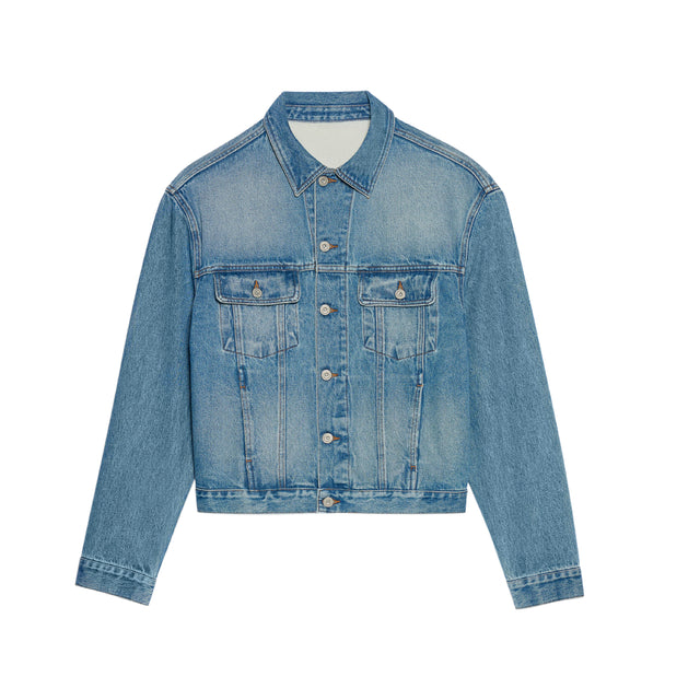 Image 1 of 1 - BLUE - JACQUEMUS Denim Jacket featuring straight cut, washed indigo denim, pointed collar, engraved metal buttons, denim patch pockets, buttoned cuffs, front and back yoke, buttoned tab on the back hem, silver hardware, large denim patch and contrast stitching. 100% cotton. Made in Portugal. 