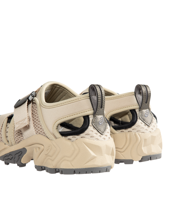 Image 3 of 5 - NEUTRAL - ASICS Mens Sneakers feature a breathable mesh and textile upper with GEL cushioning technology for enhanced comfort. Designed with a belt-style closure, heel pull tab, and durable rubber outsole. Upper: Mesh and Textile; Midsole: GEL Cushioning; Outsole: Rubber. Made in Vietnam. 