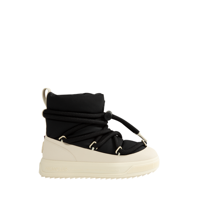 Image 1 of 4 - BLACK - Moncler Women's Altive Mid Snow Boots are designed with a boudin-quilted nylon upper and textured rubber overlays for lightweight protection and cold-weather performance. This mid-height silhouette features a wraparound drawstring fastening, pull tab at the backstay, and a round toe for comfortable everyday wear. Engineered with an EVA midsole and a Vibram MEGAGRIP tread for enhanced traction and durability, the style is finished with a lightweight TPU outsole for dependable grip in w 