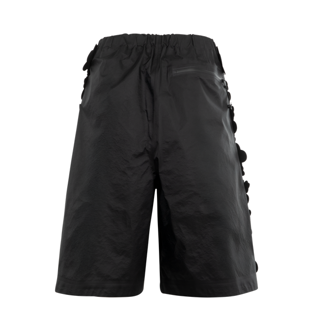 Image 2 of 3 - BLACK - TNF X CB Ellie Mountain Shorts featuring water-repellent fabric, streamlined silhouette, full-length side zippers, glossy floral appliqus trace the seams, cinched elastic waistband with a delicate flower cord lock, seam-taped finishes and a back zip pocket. 100% nylon. 