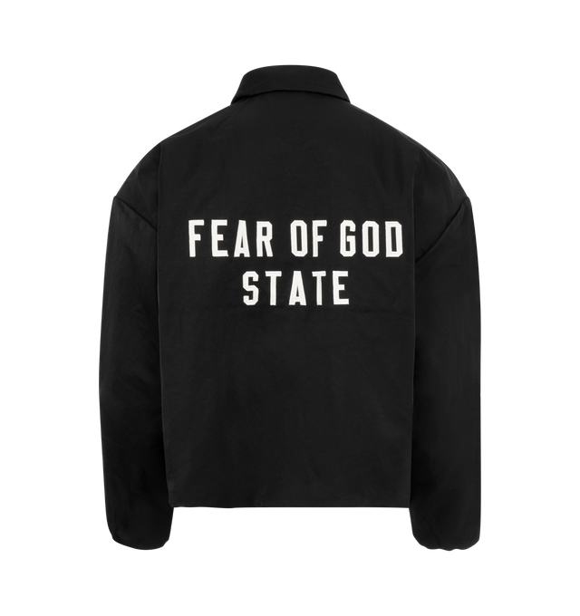 Image 2 of 3 - BLACK - Fear of God Textured Nylon Trucker Jacket has an attached hood, a snap button closure, dropped shoulders, elastic wrist cuffs, side seam pockets, a logo applique, and adjustable drawstring hem. Lined. 100% recycled nylon.   