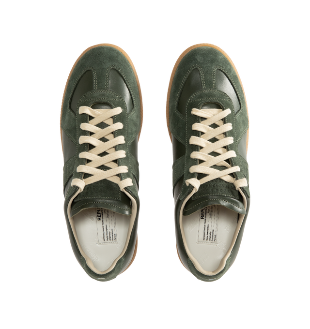 Image 5 of 5 - GREEN - Maison Margiela Men's Replica Sneakers featuring lace-up sneakers in buffed nappa calfskin and calfskin suede, contrasting sole, Maison Margiela logo label on the tab, internal Replica label, internal elastic and all-over Maison Margiela logo insole. 100% calf leather. Sole: 100% rubber. Made in Italy. 