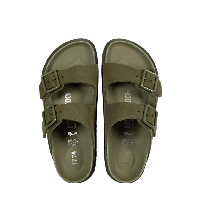 Image 4 of 4 - GREEN - Birkenstock's Arizona sandals in a narrow width. The iconic Arizona sillhouette is  updated in suede featuring adjustable straps with buckle closures, logo details, shaped insole, and EVA outsole. Upper: Luxurious fine flesh out suede, a full grain leather that has been flipped to use the fuzzy side. Footbed: Anatomical shaped BIRKENSTOCK cork-latex footbed, covered with premium, color-matching smooth nappa leather. Sole: EVA outsole with a 3mm EVA welt updates the standard die-cut ou 