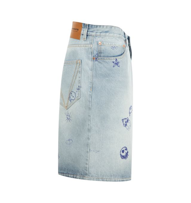 Image 3 of 3 - BLUE - Vetements Scribbled Denim Shorts are a 5-pocket style with a button fly, a logo patch at the back, silver-tone hardware, and fading, graphic, and text printed throughout. 100% cotton. Made in Italy. 