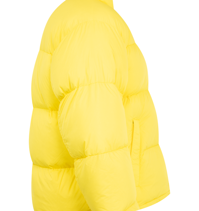 Image 3 of 3 - YELLOW - Canada Goose Men's Sterling Puffer Coat is crafted from lightweight plain-weave poly fabric with a smooth matte finish and features a regular-fit silhouette with wide quilted baffles. Designed for cold-weather protection, this down-filled coat is finished with a fixed hood with hidden cord lock, a concealed snap placket over a two-way zip closure, an exposed bottom snap, elasticized cuffs, and an adjustable drawcord hem. Functional storage includes two exterior zippered welt pockets, 
