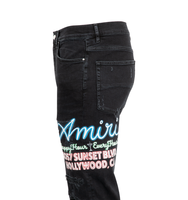 Image 3 of 4 - BLACK - AMIRI Nean Lights Slim Jeans featuring belt loops, five-pocket styling, button fly, logo appliqu at outseam, logo patch at back waistband and flared hem. 98% cotton, 2% elastane. Made in United States. 
