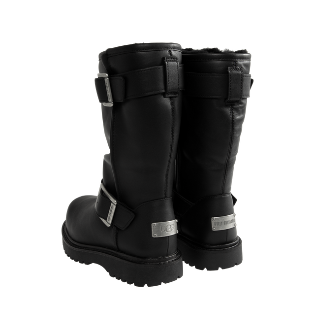 Image 3 of 4 - BLACK - UGG x Willy Chavarria Biker Boot is crafted from leather and reimagines UGG's iconic silhouette with a rugged, moto-inspired design. Featuring a mid-calf profile, chrome hardware detailing, and UGG's signature plush sheepskin lining, the boot combines bold utility styling with exceptional comfort. Main Material: Leather. Lining: Sheepskin. Unisex style in men's sizes. 