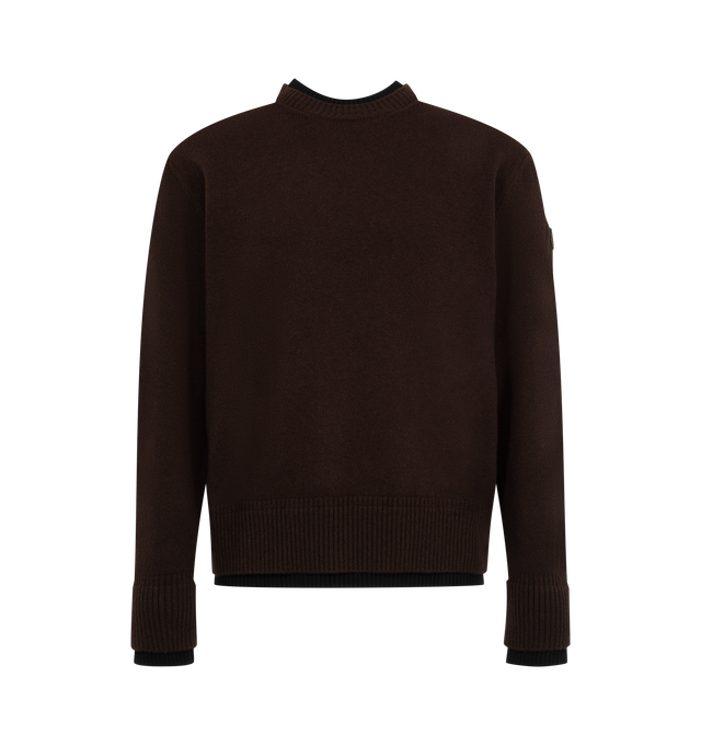 Image 1 of 1 - BROWN - Moncler Men's Crewneck Sweater is crafted from a wool and cashmere blend and features a smooth-knit construction, a crew neckline, and a regular-fit silhouette. Designed with contrasting rib-knit trims at the collar, cuffs, and hem, it is finished with a signature logo patch. Main Material: 90% Virgin Wool, 10% Cashmere. Trim: 100% Virgin Wool. Leather Tag: Cow Leather. Fit: Regular. Neckline: Crew Neck. Details: Contrasting Rib-Knit Collar, Cuffs, and Hem, Logo Patch. Made in Romania 