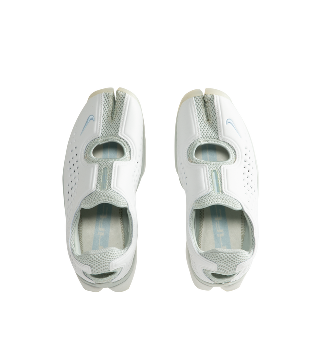 Image 5 of 5 - WHITE - Nike Women's Rift 2 Sneakers feature a padded neoprene and mesh upper with the iconic split-toe construction for a distinctive, sport-inspired silhouette. Designed for easy slip-on wear, these sneakers feature a cushioned footbed, antimicrobial sockliner, fabric lining, and lightweight foam midsole for added comfort. Finished with a durable rubber sole, the Rift 2 combines Nike's signature natural-motion-inspired design with everyday functionality. Upper: Neoprene and Mesh. Lining: Fa 