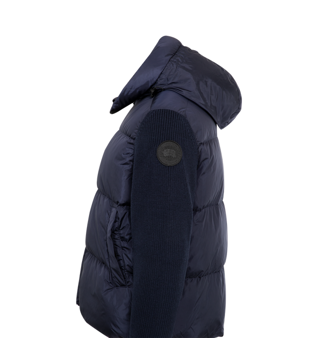 Image 3 of 3 - NAVY - CANADA GOOSE HyBridge Grove Knit Hoody featuring quilted design, hooded neckline, ribbed knit sleeves, zip fastening and logo patch. 100% Polyamide. Made in Romania. 