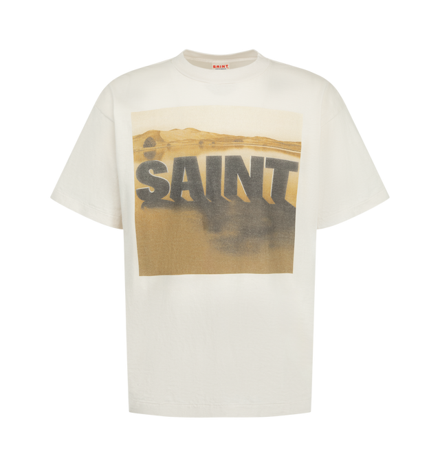 Image 1 of 2 - WHITE - Saint Michael Men's KK Short-Sleeve T-Shirt in Desert is crafted from cotton as part of a collaboration with collage artist Kosuke Kawamura. The front features a landscape-inspired graphic with dimensional "SAINT" lettering, rendered in muted sepia tones with a faded, grainy finish for a vintage appearance. Main Material: 100% Cotton. 
